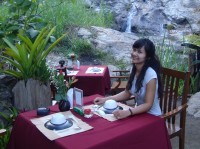 Romantic tables next to the waterfall